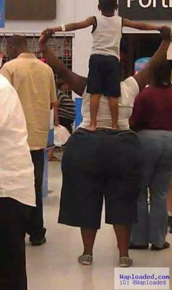 Photo: See How This Boy Is Standing On This Woman